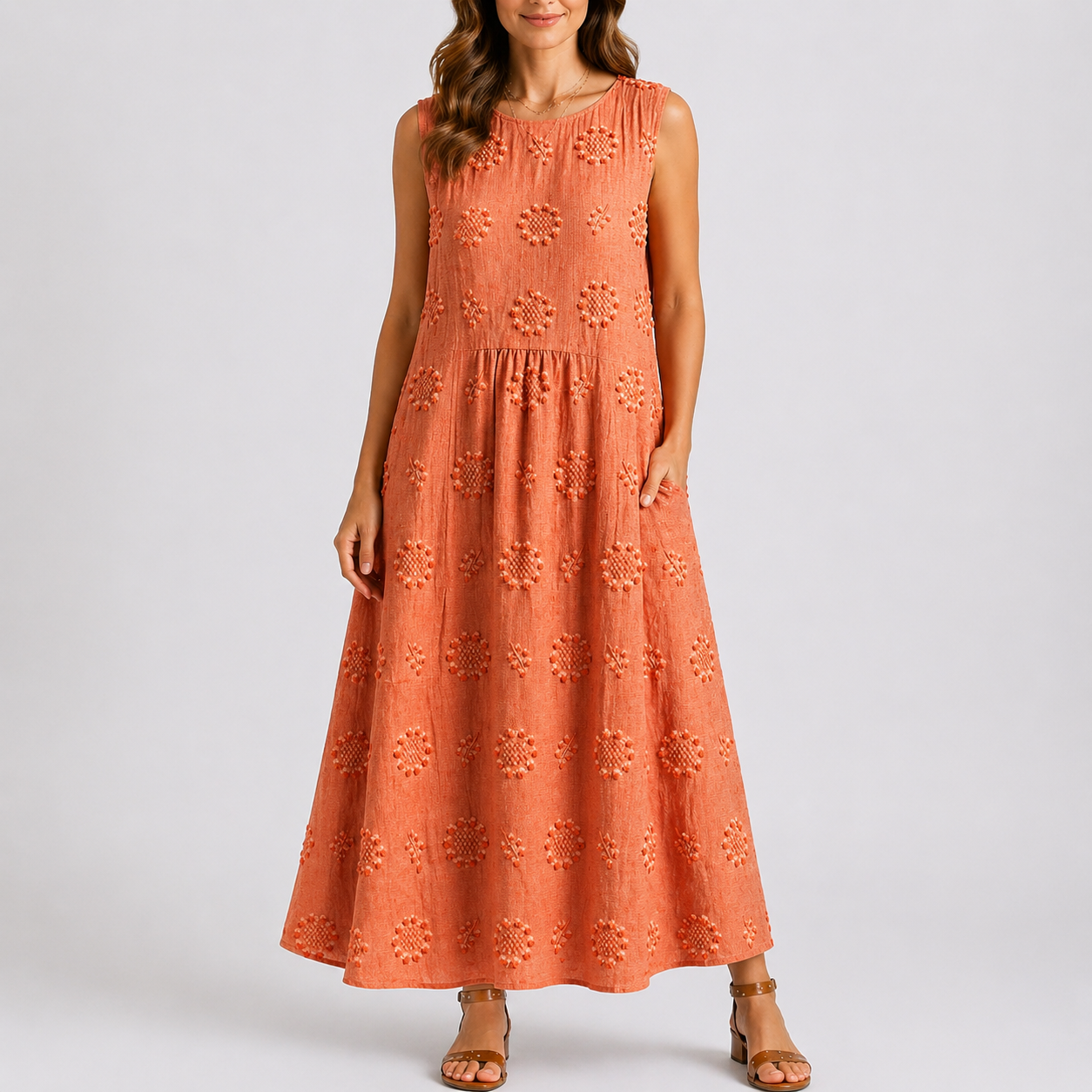 Orange - Sleeveless midaxi smock dress featuring tufted floral patterns, a round neckline, and side pockets, styled on a model against a plain background.