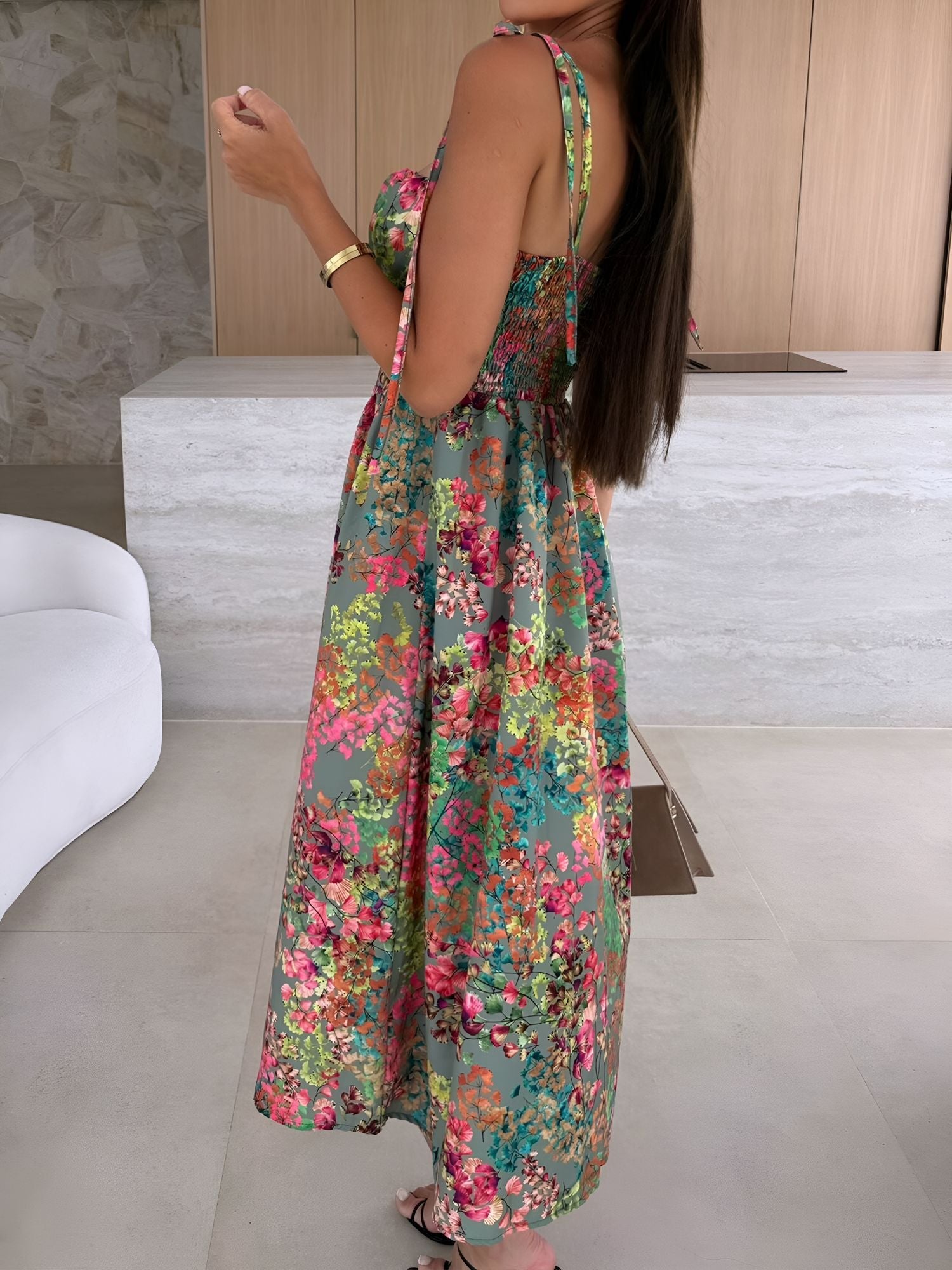 Green - Woman modelling a printed A-line midi dress featuring a sweetheart neckline, button-down bodice, and adjustable tie-straps.