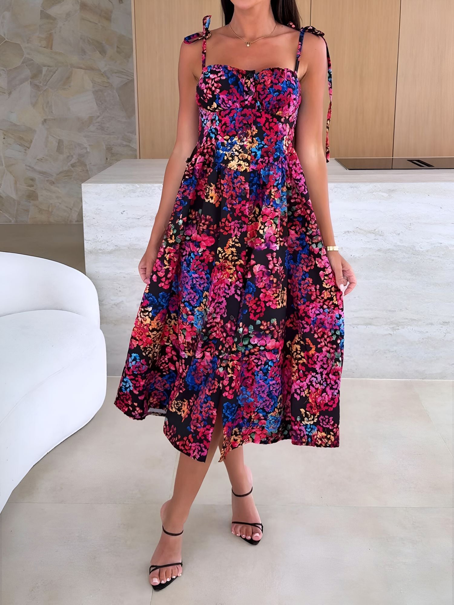 Black - Woman modelling a printed A-line midi dress featuring a sweetheart neckline, button-down bodice, and adjustable tie-straps.