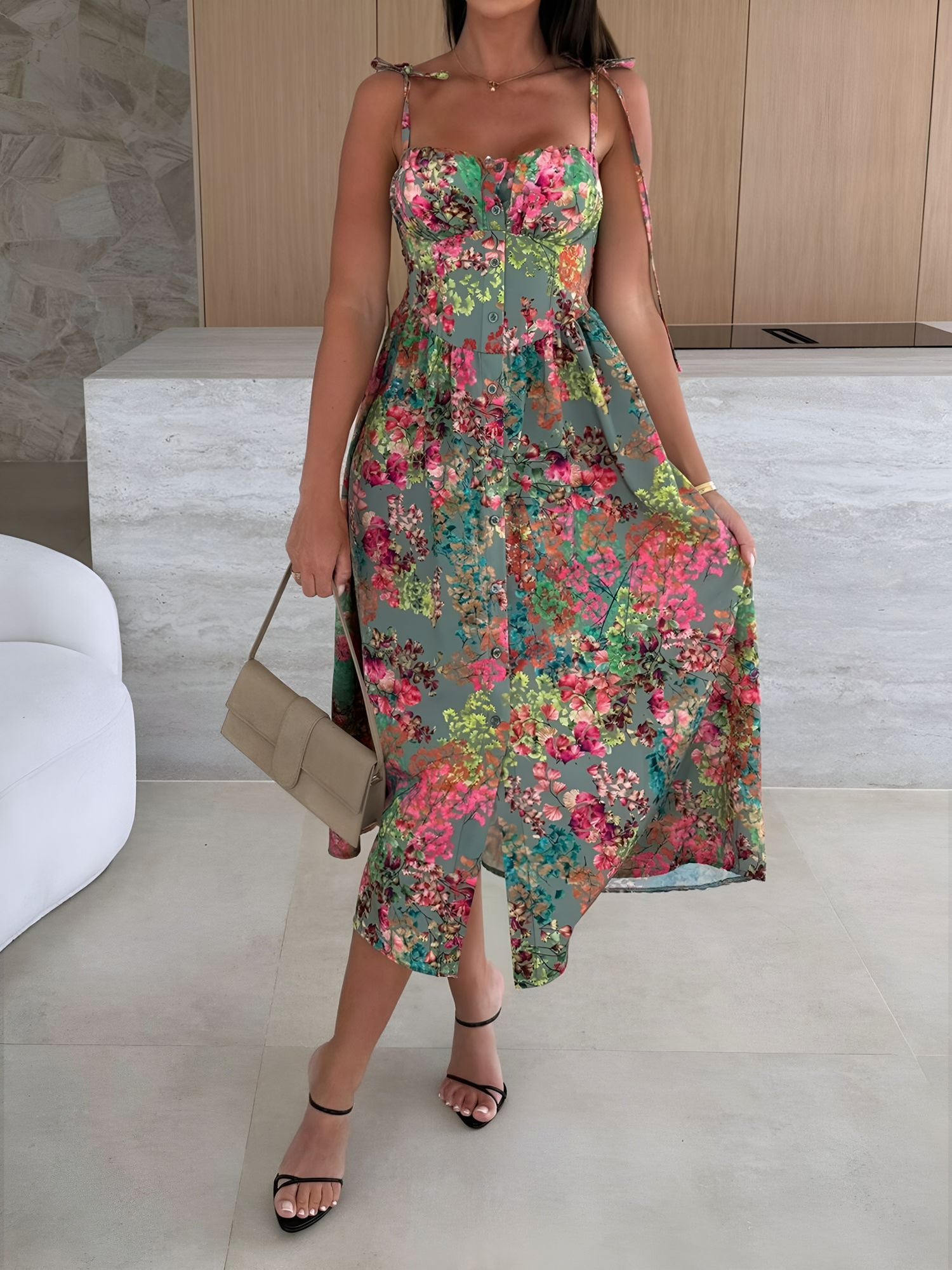 Green - Woman modelling a printed A-line midi dress featuring a sweetheart neckline, button-down bodice, and adjustable tie-straps.