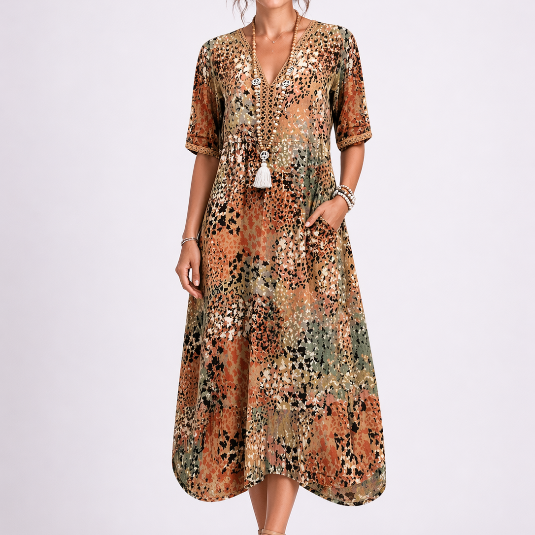 Sand & Beige - Model wearing a woven abstract-print V-neck relaxed midi dress with short sleeves and side pockets