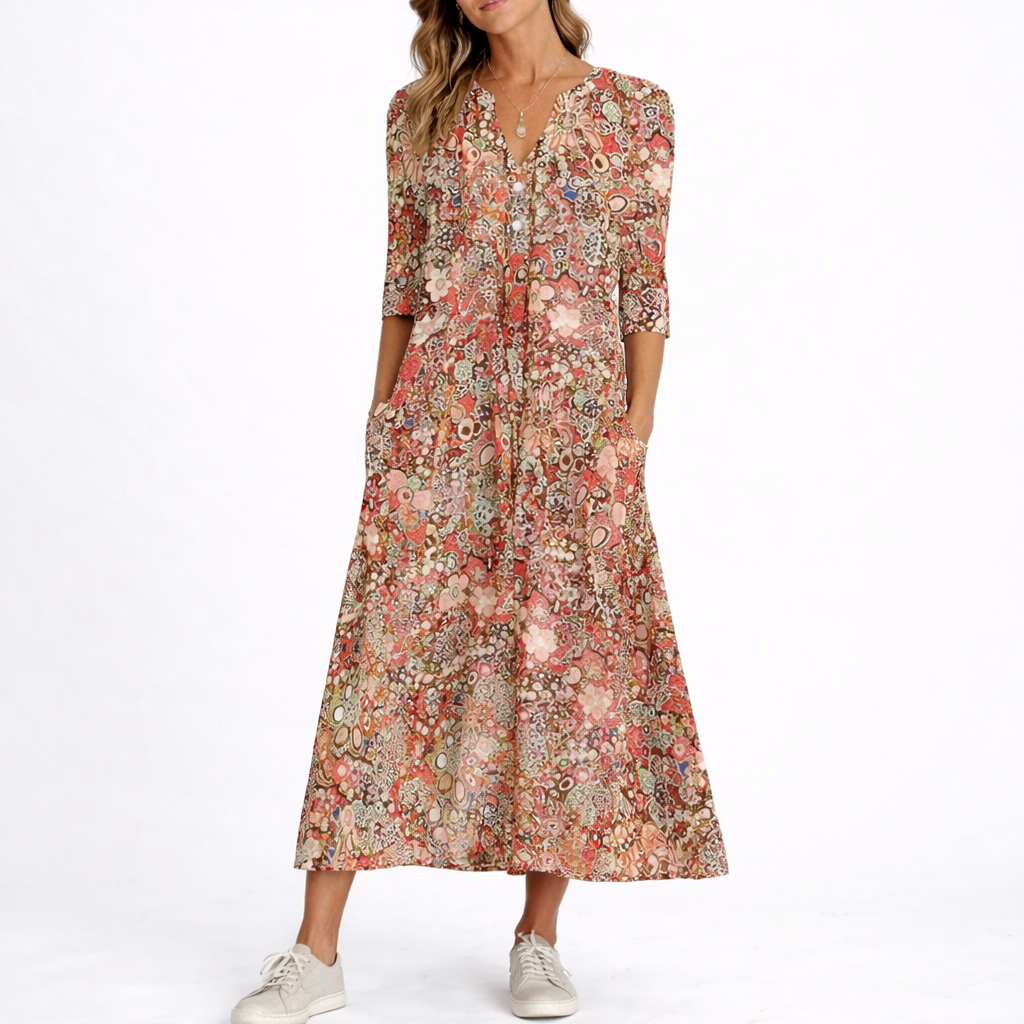 Red - Woman wearing a woven floral 3/4-sleeve relaxed midaxi dress with a V-neckline, button placket, and side pockets