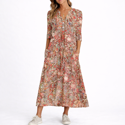 Red - Woman wearing a woven floral 3/4-sleeve relaxed midaxi dress with a V-neckline, button placket, and side pockets