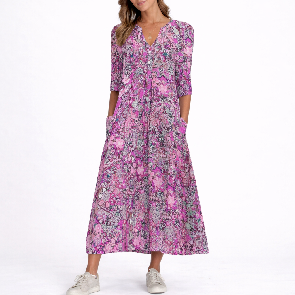 Purple - Woman wearing a woven floral 3/4-sleeve relaxed midaxi dress with a V-neckline, button placket, and side pockets