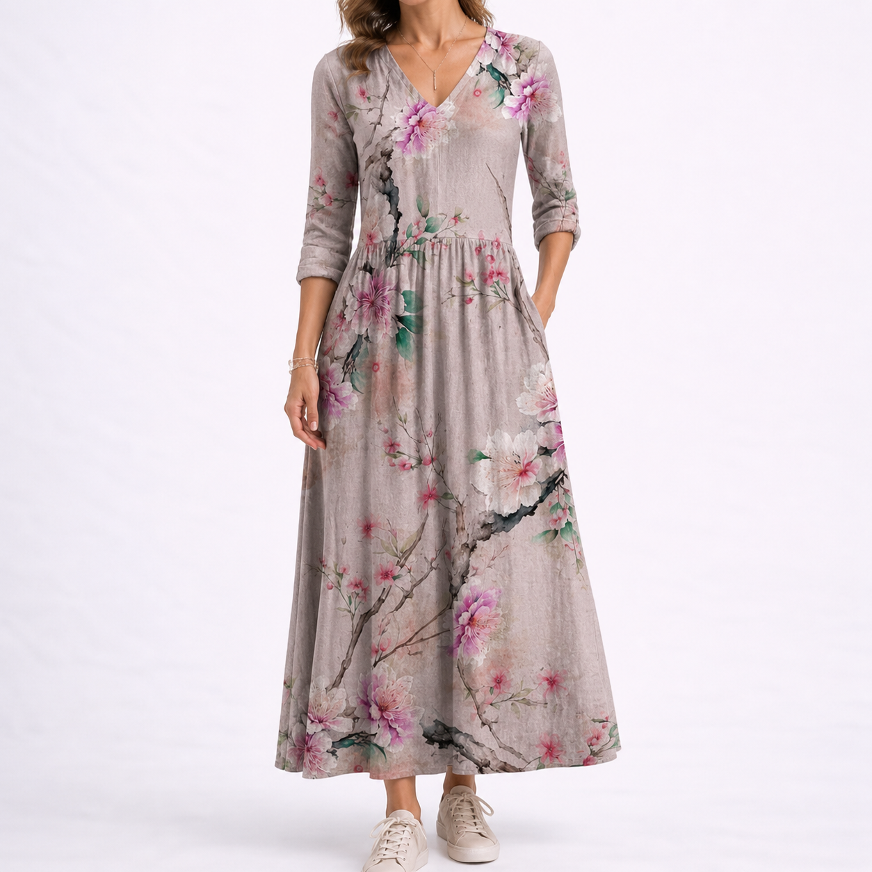 Grey - Woman wearing a woven floral midaxi dress with a V-neckline, 3/4-sleeves, and a gathered waist with side pockets, styled with trainers.