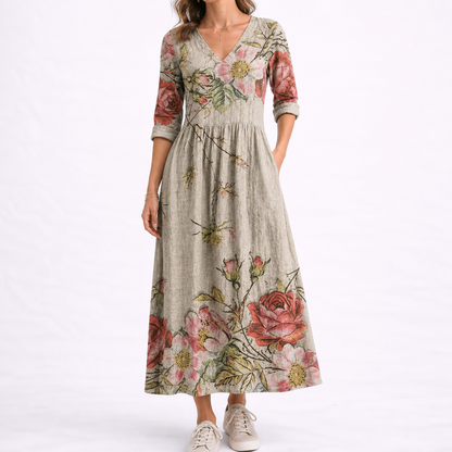 Chalk - Woman wearing a woven floral midaxi dress with a V-neckline, 3/4-sleeves, and a gathered waist with side pockets, styled with trainers.