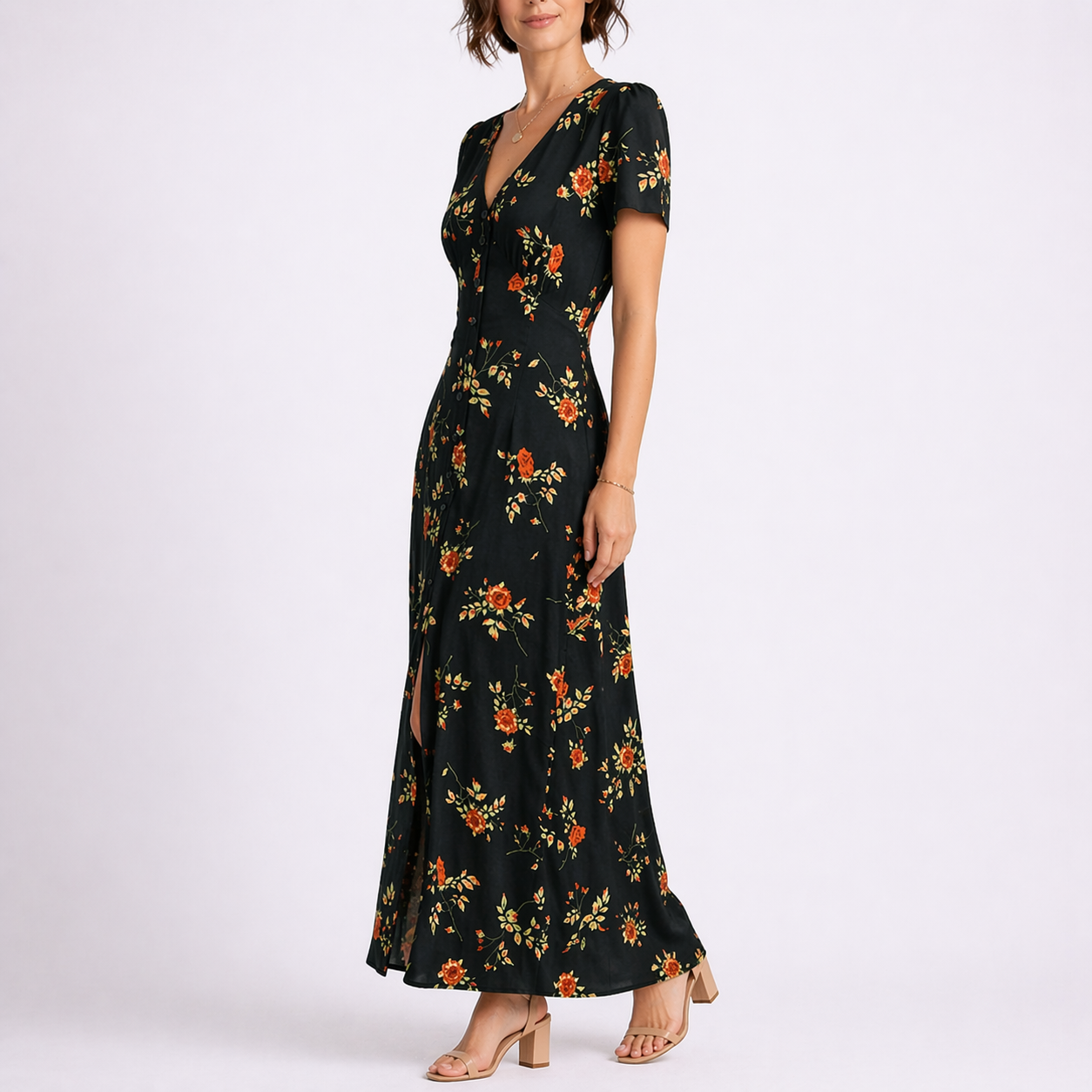 Floral Black - Woman wearing a woven floral short-sleeve maxi dress with a v-neckline and button-down front.