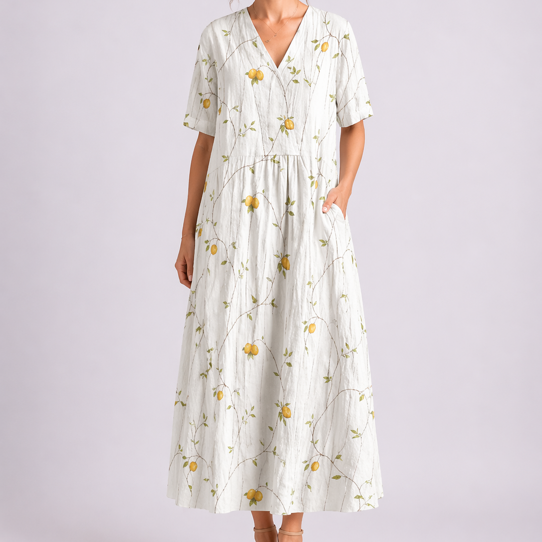 Yellow & White - Woman wearing a woven floral V-neck maxi dress with short sleeves and side pockets.