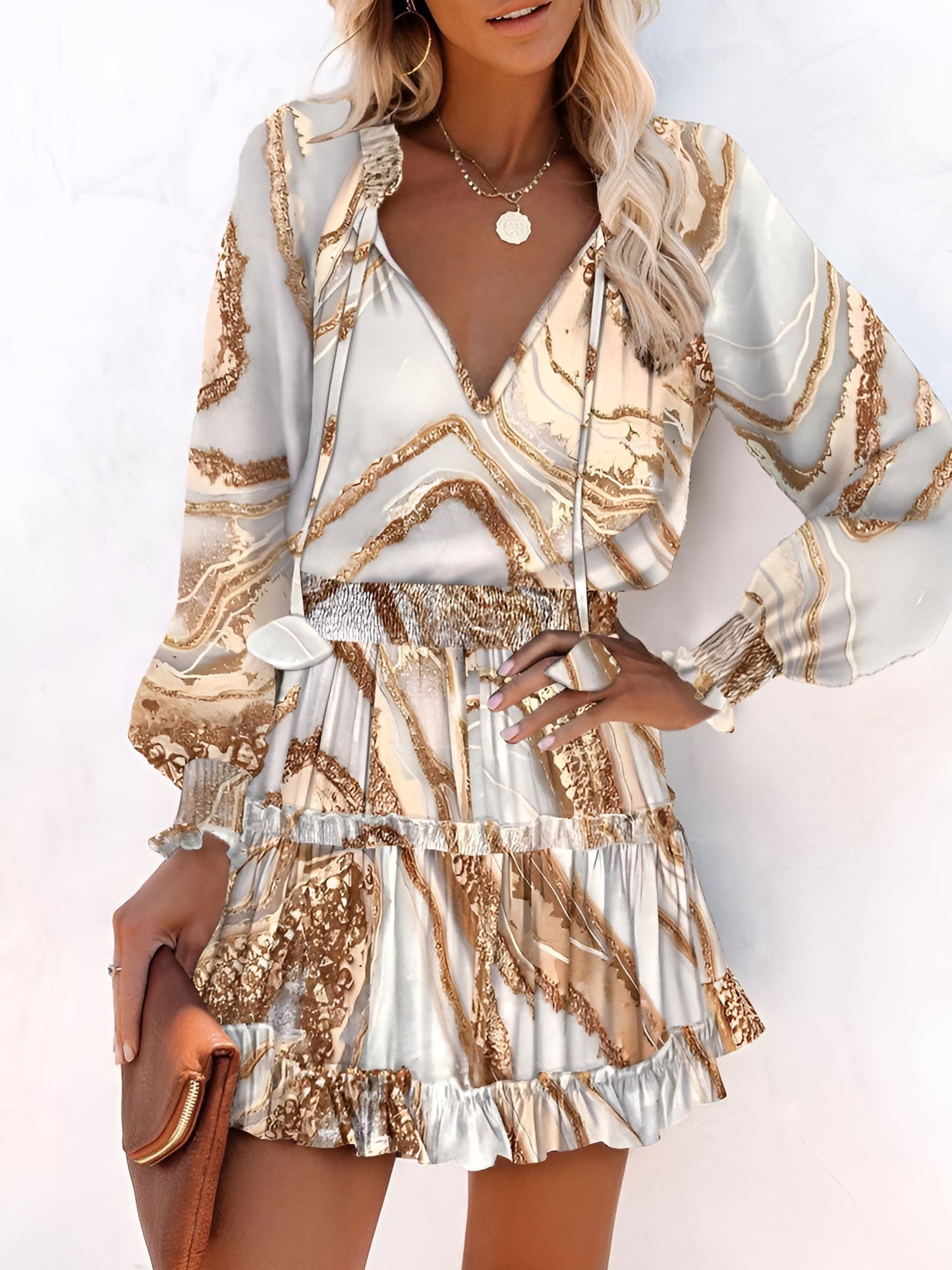 Khaki - Woman wearing a woven floral V-neck mini dress with long sleeves, smocked waist, and tiered ruffle skirt.
