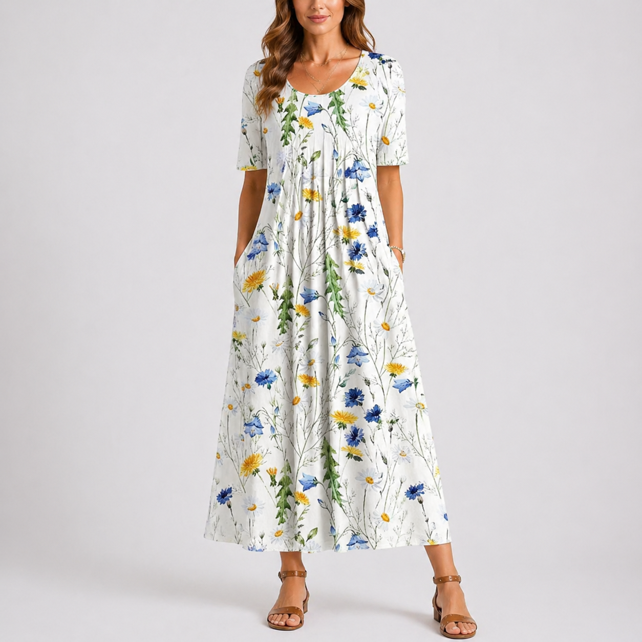 Floral White - Woman wearing a woven leaf-print short-sleeve smock maxi dress with a scoop neckline and flowing skirt.
