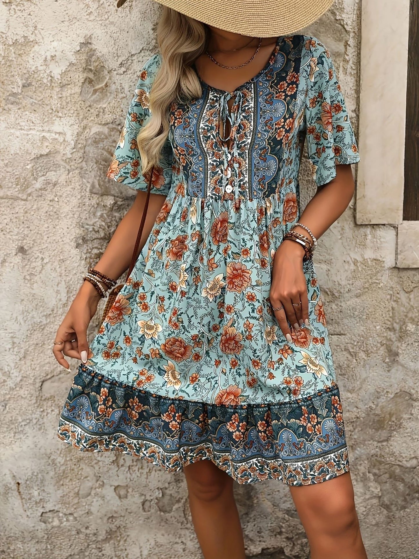 Mixed Colors - Woman wearing a woven paisley print V-neck tiered mini dress with short sleeves and front button detailing.